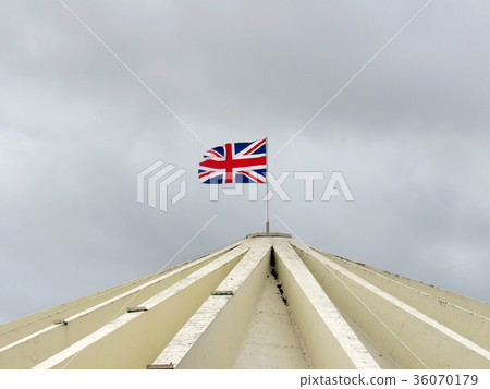 Flag of england floating on a building roof Flag of england floating on a building roof 36070179