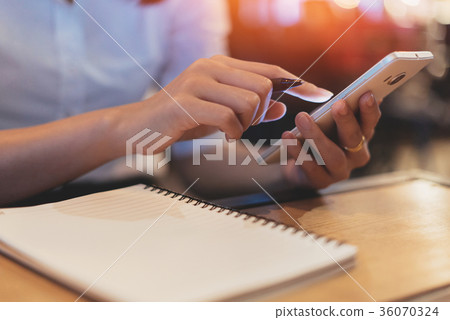 Close up of woman hand holding smartphone. Close up of woman hand holding smartphone. 36070324