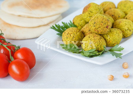 Fresh baked falafel with pita. Fresh baked falafel with pita. 36073235