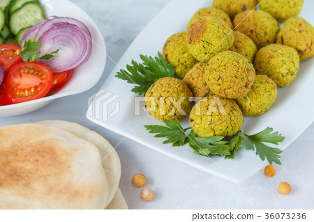 Fresh baked falafel with pita. Fresh baked falafel with pita. 36073236