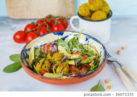Falafel salad with fresh vegetables, sprouts Falafel salad with fresh vegetables, sprouts 36073335
