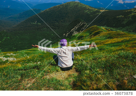 woman traveler sitting on mountainous landscape woman traveler sitting on mountainous landscape 36073878
