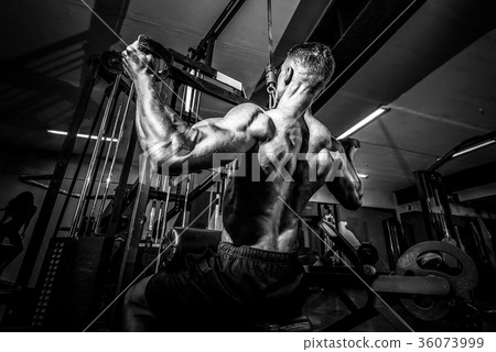 Strong Bodybuilder Doing Heavy Weight Exercise For 36073999