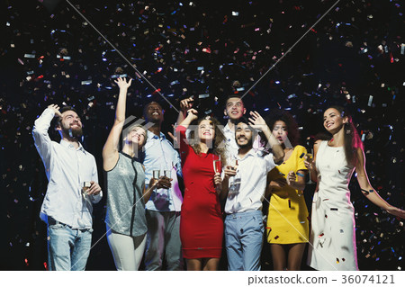 Happy young friends having party at night club Happy young friends having party at night club 36074121