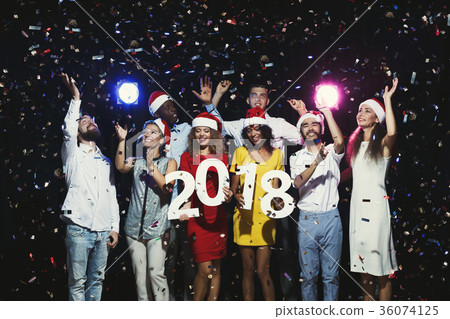 Young multiethnic people with wooden numbers 2018 36074125