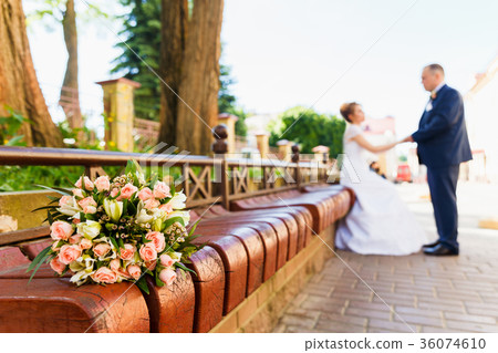 Bride and groom with bridal bouquet 36074610
