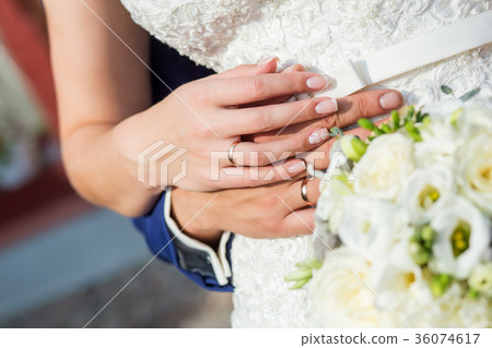 The couple cuddling and holding bridal bouquet. The couple cuddling and holding bridal bouquet. 36074617