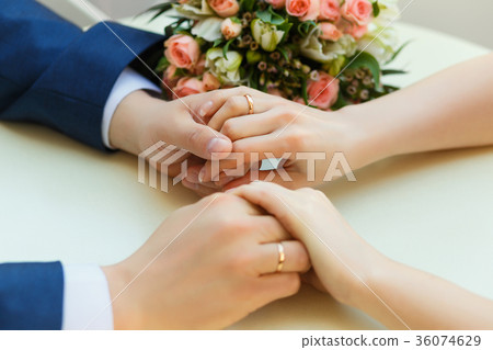Close-up of wedding hands with rings Close-up of wedding hands with rings 36074629
