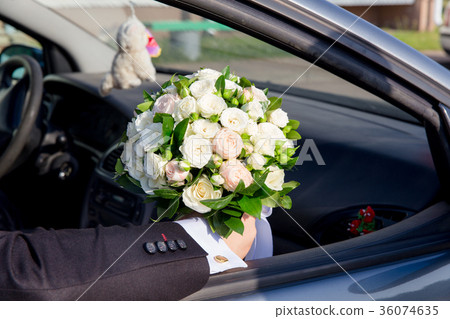 The groom sitting in car The groom sitting in car 36074635