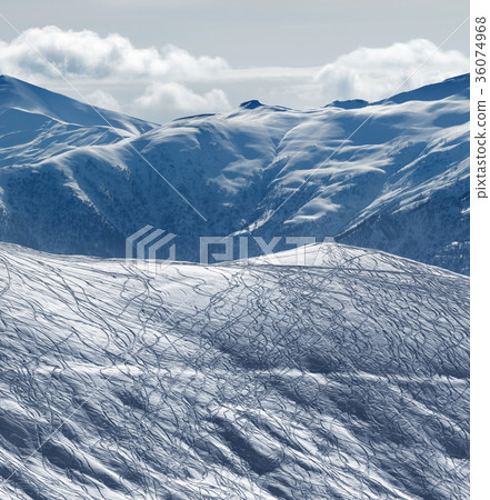 Slope for freeriding with traces from snowboards Slope for freeriding with traces from snowboards 36074968