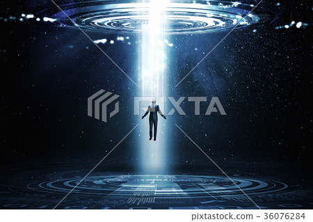 Man standing in light 36076284
