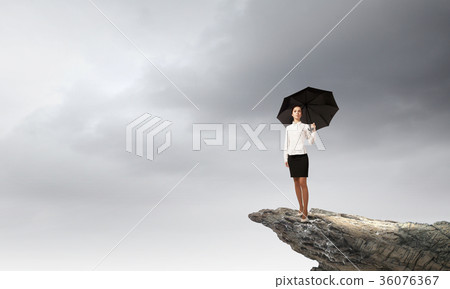 Woman with umbrella 36076367