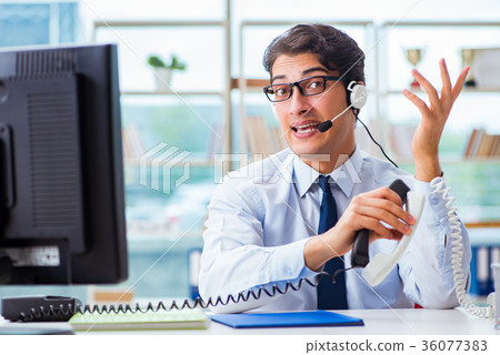 Unhappy angry call center worker frustrated with Unhappy angry call center worker frustrated with 36077383