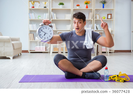 Young man exercising at home in sports and healthy Young man exercising at home in sports and healthy 36077428
