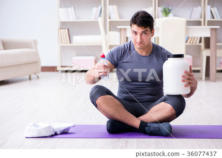Man with food supplements in sports and healthy 36077437