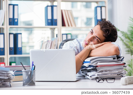 Tired exhausted businessman sitting in the office Tired exhausted businessman sitting in the office 36077439