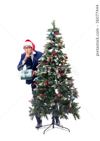 Businessman decorating christmas tree isolated on Businessman decorating christmas tree isolated on 36077444