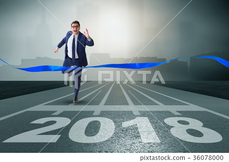 Businessman running towards new year 2018 Businessman running towards new year 2018 36078000