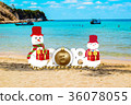 Happy new year for 2018 with snowman on the beach  36078055