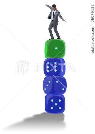 Businessman balancing on top of dice stack in 36079138