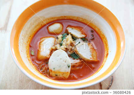 Fish and fishball Tom yum noodle on wood background , Thai food Fish and fishball Tom yum noodle on wood background , Thai food 36080426