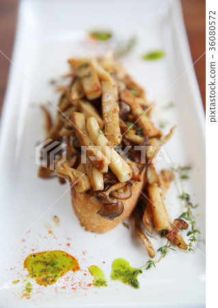 Crispy toasted white bread with mushrooms on wood background table 36080572