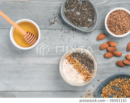 Overnight oats in jar and ingredients on gray Overnight oats in jar and ingredients on gray 36091181