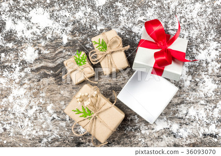 Open and blank white gift with red ribbon bow. 36093070