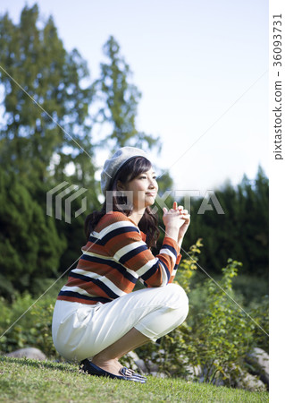 A woman relaxing in the park 36093731