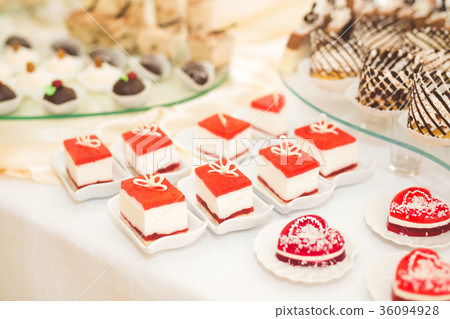 Different kinds of baked sweets on a buffet 36094928