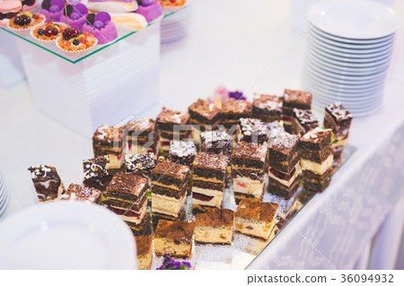 Different kinds of baked sweets on a buffet Different kinds of baked sweets on a buffet 36094932