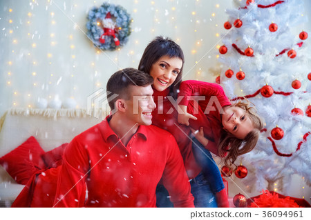 Playful happy family celebrating Christmas Playful happy family celebrating Christmas 36094961