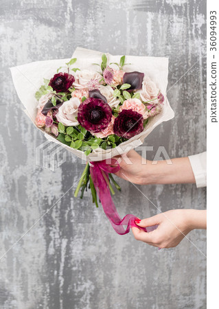 beautiful luxury bouquet of mixed flowers in woman 36094993