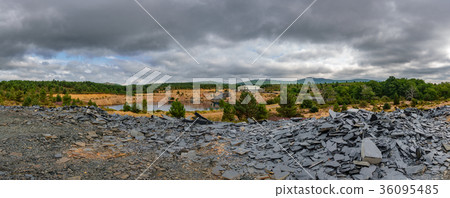 Abandoned slate mine panorama with water hole Abandoned slate mine panorama with water hole 36095485