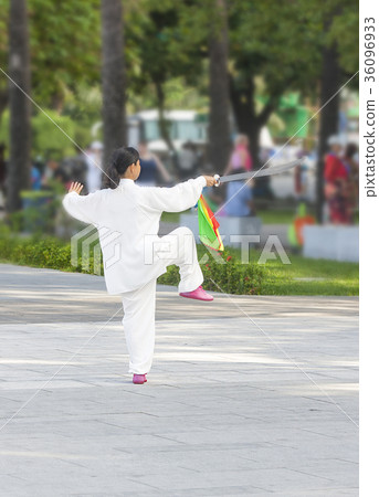 Chinese deals in the Park exercise with a sword. Chinese deals in the Park exercise with a sword. 36096933