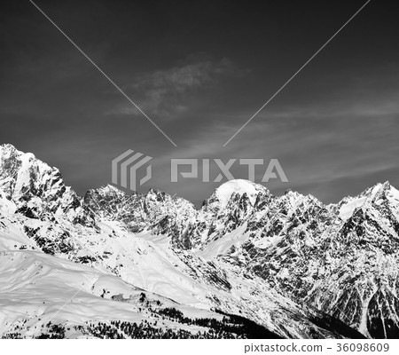 Black and white snow mountain in winter at sun day 36098609