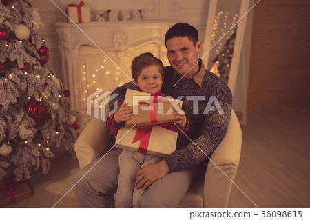 Father with son at home on Christmas evening 36098615