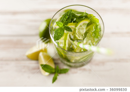 Mojito cocktail on white wood background Mojito cocktail on white wood background 36099830