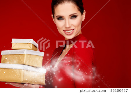 Woman with christmas box gift 36100437