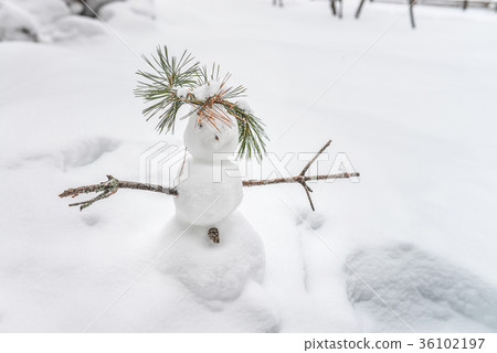 Small funny snowman on winter background Small funny snowman on winter background 36102197