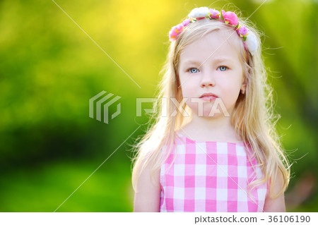 Portrait of cute little cheerful girl outdoors on sunny summer day 36106190