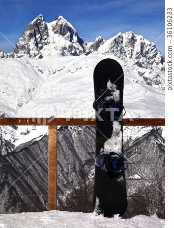 Snowboards in outdoor cafe at ski resort Snowboards in outdoor cafe at ski resort 36106283
