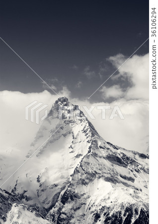 Black and white snowy mountains in clouds Black and white snowy mountains in clouds 36106294