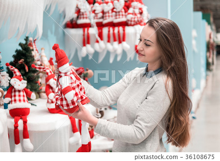 customer girl choosing gifts for Christmas and New 36108675