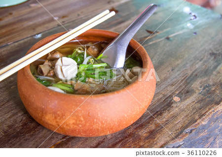 Clay pot rice noodles put on a wooden table 36110226
