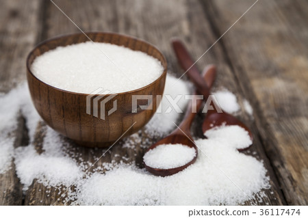 Bowl with sugar and a wooden spoons Bowl with sugar and a wooden spoons 36117474