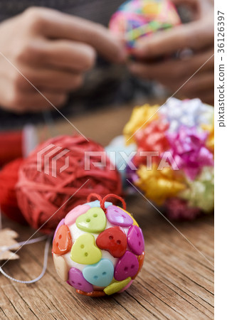 man making handmade christmas balls man making handmade christmas balls 36126397