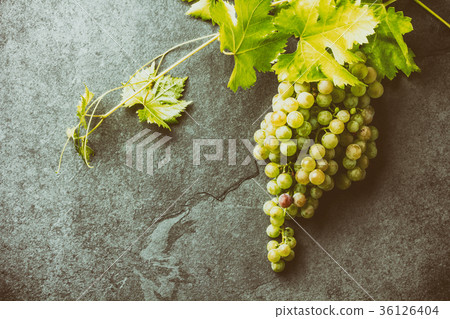 Grape and corkscrews wine concept, Stone Grape and corkscrews wine concept, Stone 36126404
