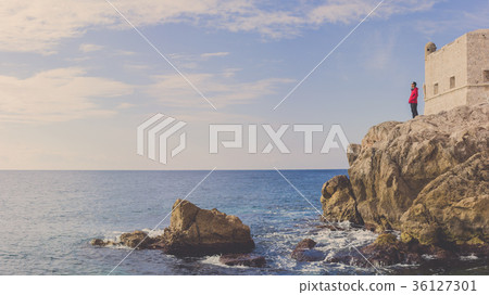 A man standing at Adriatic sea on fort, Dubrovnik. 36127301