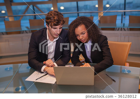 Business people having meeting around table in Business people having meeting around table in 36128012